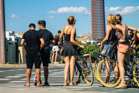 Seville Spain September 18, 2021 People rolling with a bicycle in the streets of Seville, an emblematic city and the capital of the region of Andalusia, in the south of Spainのeditorial素材