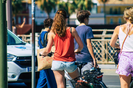 Seville Spain September 18, 2021 People rolling with a bicycle in the streets of Seville, an emblematic city and the capital of the region of Andalusia, in the south of Spainのeditorial素材