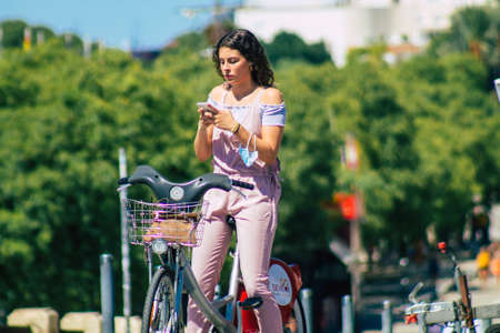 Seville Spain September 18, 2021 People rolling with a bicycle in the streets of Seville, an emblematic city and the capital of the region of Andalusia, in the south of Spainのeditorial素材