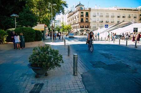 Seville Spain September 18, 2021 People rolling with a bicycle in the streets of Seville, an emblematic city and the capital of the region of Andalusia, in the south of Spainのeditorial素材