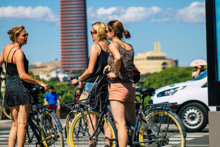 Seville Spain September 18, 2021 People rolling with a bicycle in the streets of Seville, an emblematic city and the capital of the region of Andalusia, in the south of Spainのeditorial素材