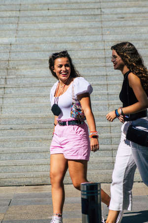 Seville Spain September 18, 2021 Pedestrians walking in the street during the coronavirus outbreak hitting Spain, wearing a mask is not mandatory but most of people wear itのeditorial素材
