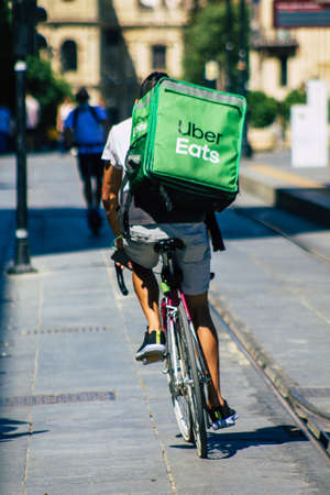 Seville Spain September 18, 2021 People rolling with a bicycle in the streets of Seville, an emblematic city and the capital of the region of Andalusia, in the south of Spainのeditorial素材