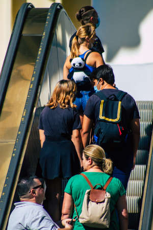 Seville Spain September 18, 2021 Pedestrians using an escalator during the coronavirus outbreak hitting Spain, wearing a mask is not mandatory but most of people wear itのeditorial素材