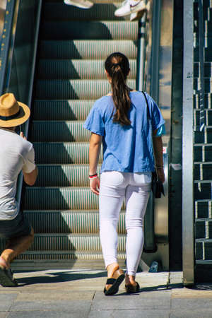 Seville Spain September 18, 2021 Pedestrians using an escalator during the coronavirus outbreak hitting Spain, wearing a mask is not mandatory but most of people wear itのeditorial素材