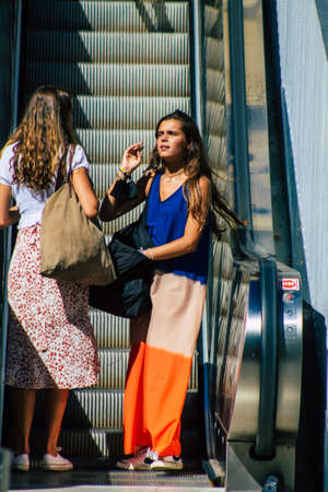 Seville Spain September 18, 2021 Pedestrians using an escalator during the coronavirus outbreak hitting Spain, wearing a mask is not mandatory but most of people wear itのeditorial素材