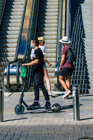 Seville Spain September 18, 2021 People rolling with an electric scooter in the streets of Seville,...