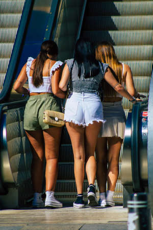 Seville Spain September 18, 2021 Pedestrians using an escalator during the coronavirus outbreak hitting Spain, wearing a mask is not mandatory but most of people wear itのeditorial素材