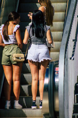 Seville Spain September 18, 2021 Pedestrians using an escalator during the coronavirus outbreak hitting Spain, wearing a mask is not mandatory but most of people wear itのeditorial素材