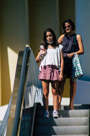 Seville Spain September 18, 2021 Pedestrians using an escalator during the coronavirus outbreak hitting Spain, wearing a mask is not mandatory but most of people wear itのeditorial素材