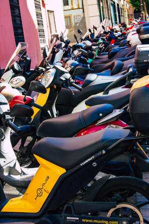 Seville Spain September 18, 2021 Motorcycles parked in the streets of Seville, an emblematic city and the capital of the region of Andalusia, in the south of Spainのeditorial素材