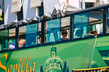 Seville Spain September 18, 2021 Tourist bus driving through the streets of Seville during the coronavirus outbreak hitting Spain, wearing a mask is mandatoryのeditorial素材