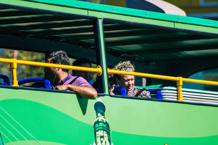 Seville Spain September 18, 2021 Tourist bus driving through the streets of Seville during the coronavirus outbreak hitting Spain, wearing a mask is mandatoryのeditorial素材