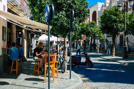 Seville Spain September 18, 2021 Pedestrians walking in the street during the coronavirus outbreak hitting Spain, wearing a mask is not mandatory but most of people wear itのeditorial素材