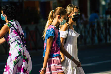 Seville Spain September 18, 2021 Pedestrians walking in the street during the coronavirus outbreak hitting Spain, wearing a mask is not mandatory but most of people wear itのeditorial素材
