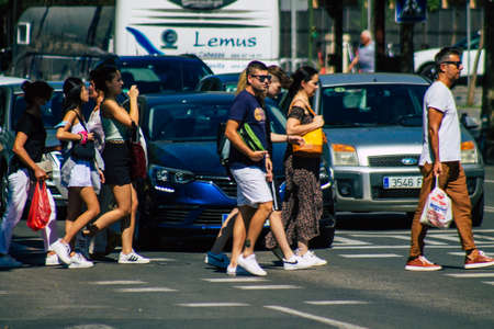 Seville Spain September 18, 2021 Pedestrians walking in the street during the coronavirus outbreak hitting Spain, wearing a mask is not mandatory but most of people wear itのeditorial素材