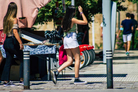 Seville Spain September 18, 2021 Pedestrians walking in the street during the coronavirus outbreak hitting Spain, wearing a mask is not mandatory but most of people wear itのeditorial素材
