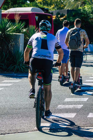 Seville Spain September 18, 2021 People rolling with a bicycle in the streets of Seville, an emblematic city and the capital of the region of Andalusia, in the south of Spainのeditorial素材