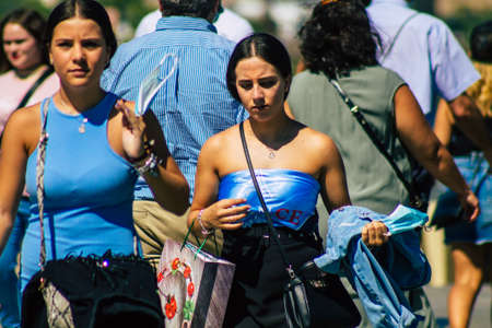 Seville Spain September 18, 2021 Pedestrians walking in the street during the coronavirus outbreak hitting Spain, wearing a mask is not mandatory but most of people wear itのeditorial素材