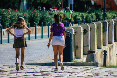 Seville Spain September 18, 2021 Pedestrians walking in the street during the coronavirus outbreak hitting Spain, wearing a mask is not mandatory but most of people wear itのeditorial素材