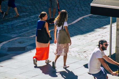 Seville Spain September 18, 2021 Pedestrians walking in the street during the coronavirus outbreak hitting Spain, wearing a mask is not mandatory but most of people wear itのeditorial素材
