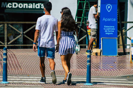 Seville Spain September 18, 2021 Pedestrians walking in the street during the coronavirus outbreak hitting Spain, wearing a mask is not mandatory but most of people wear itのeditorial素材
