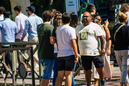 Seville Spain September 18, 2021 Pedestrians walking in the street during the coronavirus outbreak hitting Spain, wearing a mask is not mandatory but most of people wear itのeditorial素材