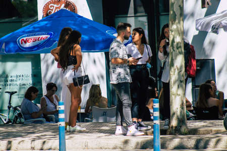Seville Spain September 18, 2021 Pedestrians walking in the street during the coronavirus outbreak hitting Spain, wearing a mask is not mandatory but most of people wear itのeditorial素材