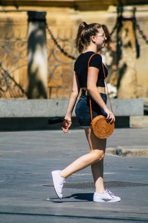 Seville Spain September 18, 2021 Pedestrians walking in the street during the coronavirus outbreak hitting Spain, wearing a mask is not mandatory but most of people wear itのeditorial素材