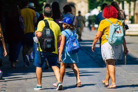 Seville Spain September 18, 2021 Pedestrians walking in the street during the coronavirus outbreak hitting Spain, wearing a mask is not mandatory but most of people wear itのeditorial素材