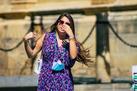Seville Spain September 18, 2021 Pedestrians walking in the street during the coronavirus outbreak hitting Spain, wearing a mask is not mandatory but most of people wear itのeditorial素材