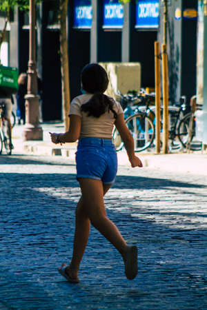 Seville Spain September 18, 2021 Pedestrians walking in the street during the coronavirus outbreak hitting Spain, wearing a mask is not mandatory but most of people wear itのeditorial素材