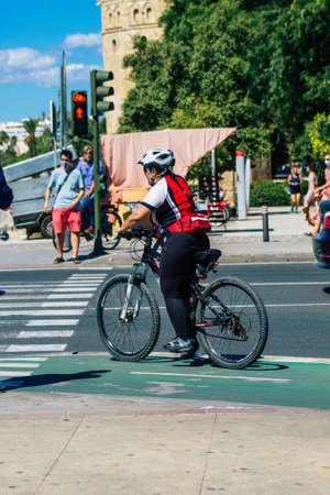 Seville Spain September 18, 2021 People rolling with a bicycle in the streets of Seville, an emblematic city and the capital of the region of Andalusia, in the south of Spainのeditorial素材