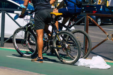 Seville Spain September 18, 2021 People rolling with a bicycle in the streets of Seville, an emblematic city and the capital of the region of Andalusia, in the south of Spainのeditorial素材