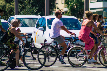 Seville Spain September 18, 2021 People rolling with a bicycle in the streets of Seville, an emblematic city and the capital of the region of Andalusia, in the south of Spainのeditorial素材