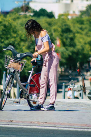 Seville Spain September 18, 2021 People rolling with a bicycle in the streets of Seville, an emblematic city and the capital of the region of Andalusia, in the south of Spainのeditorial素材