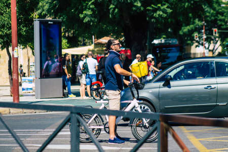 Seville Spain September 18, 2021 People rolling with a bicycle in the streets of Seville, an emblematic city and the capital of the region of Andalusia, in the south of Spainのeditorial素材