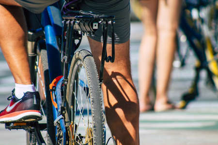 Seville Spain September 18, 2021 People rolling with a bicycle in the streets of Seville, an emblematic city and the capital of the region of Andalusia, in the south of Spainのeditorial素材
