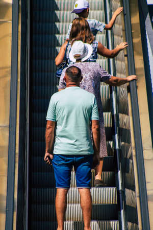 Seville Spain September 18, 2021 Pedestrians using an escalator during the coronavirus outbreak hitting Spain, wearing a mask is not mandatory but most of people wear itのeditorial素材