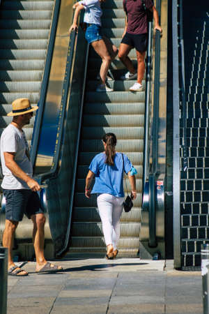 Seville Spain September 18, 2021 Pedestrians using an escalator during the coronavirus outbreak hitting Spain, wearing a mask is not mandatory but most of people wear itのeditorial素材