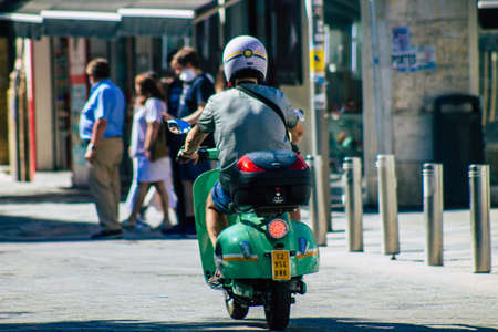 Seville Spain September 18, 2021 People rolling with a motorcycle in the streets of Seville, an emblematic city and the capital of the region of Andalusia, in the south of Spainのeditorial素材