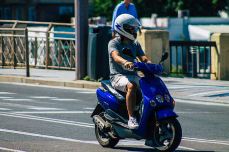 Seville Spain September 18, 2021 People rolling with a motorcycle in the streets of Seville, an emblematic city and the capital of the region of Andalusia, in the south of Spainのeditorial素材