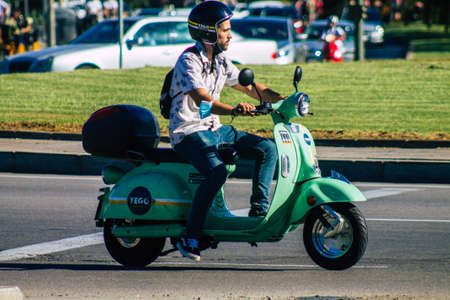 Seville Spain September 18, 2021 People rolling with a motorcycle in the streets of Seville, an emblematic city and the capital of the region of Andalusia, in the south of Spainのeditorial素材
