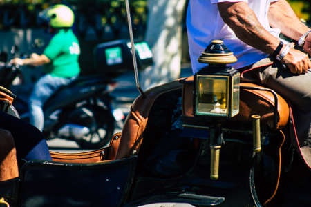 Seville Spain September 18, 2021 Horse drawn carriage ride through the streets of Seville during the coronavirus outbreak hitting Spain, wearing a mask is mandatoryのeditorial素材