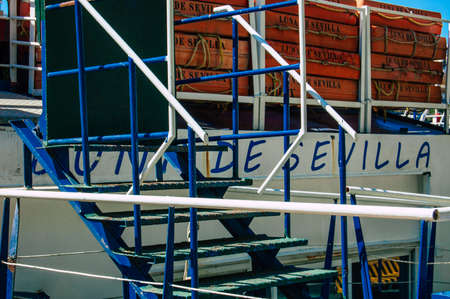 Seville Spain September 18, 2021 Tourist boats on the Guadalquivir River that crosses Seville, an emblematic city and the capital of the region of Andalusia, in the south of Spainのeditorial素材