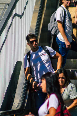 Seville Spain September 18, 2021 Pedestrians using an escalator during the coronavirus outbreak hitting Spain, wearing a mask is not mandatory but most of people wear itのeditorial素材