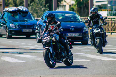 Seville Spain September 18, 2021 People rolling with a motorcycle in the streets of Seville, an emblematic city and the capital of the region of Andalusia, in the south of Spainのeditorial素材