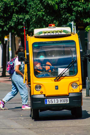 Seville Spain September 22, 2021 Garbage truck driving through the streets of Seville, an emblematic...