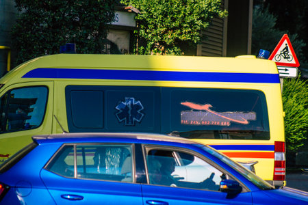 Seville Spain September 22, 2021 Ambulance driving through the streets of Seville during the coronavirus outbreak hitting Spain, wearing a mask is mandatoryのeditorial素材