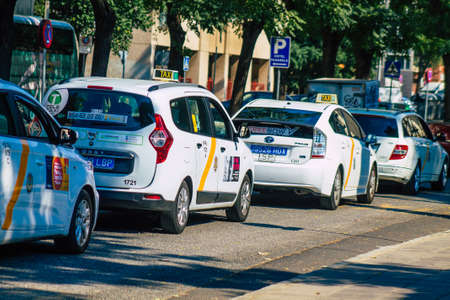 Seville Spain September 28, 2021 Taxi driving through the streets of Seville during the coronavirus outbreak hitting Spain, wearing a mask is mandatoryのeditorial素材